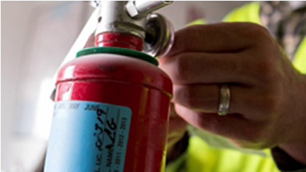 Person holding fire extinguisher