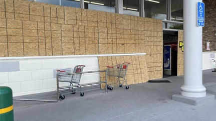 boarded up store windows