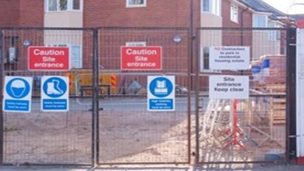 construction site behind a fence